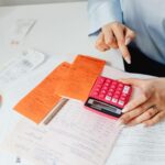 person holding oink calculator